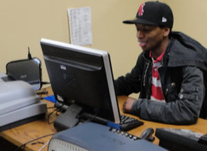 A young man working on a computer